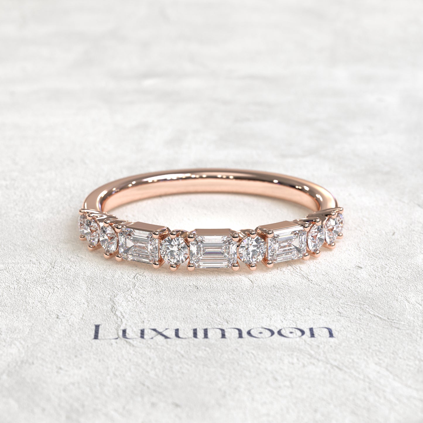 The Solenthia – East-West Emerald & Round Diamond Band