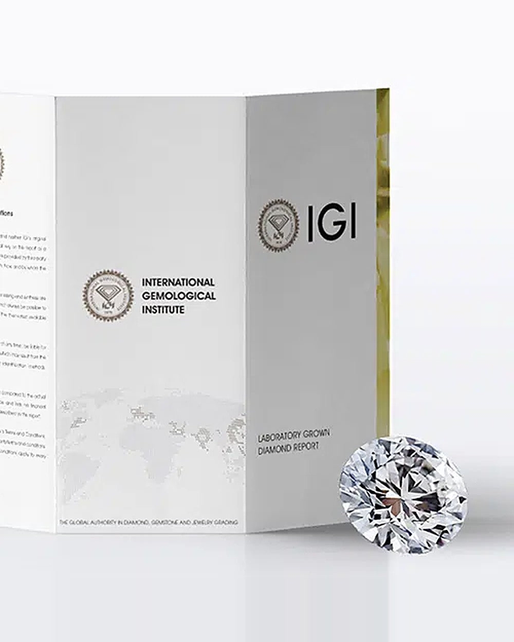 IGI laboratory grown diamond report beside a round diamond