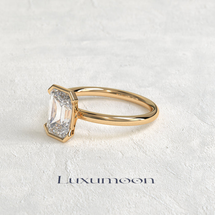 The Elenthia – 3 CT Emerald Half Bezel Diamond Ring