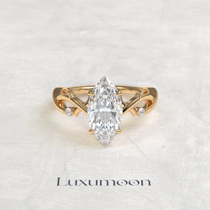 El anillo de compromiso de hoja de vid con diamante marquesa de 1,5 quilates Elya