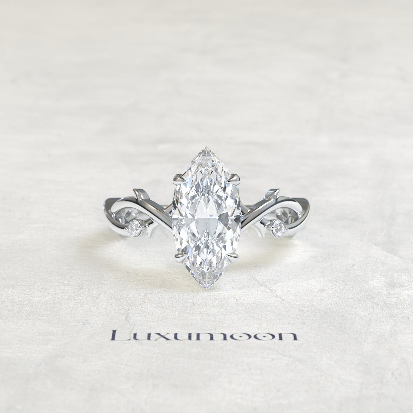 El anillo de compromiso de hoja de vid con diamante marquesa de 1,5 quilates Elya
