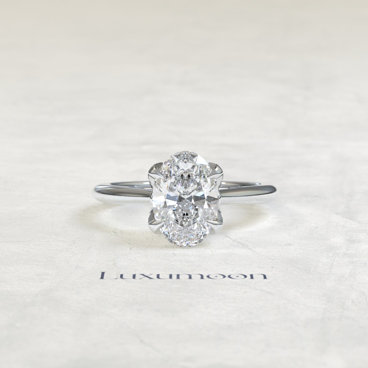 La bague de fiançailles Cora – Diamant ovale pavé de pétales et sertie de griffes florales