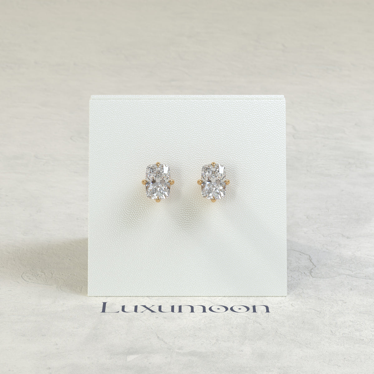 The Nora – 3 Ct Elongated Cushion Diamond Solitaire Studs in East-West Prong Basket