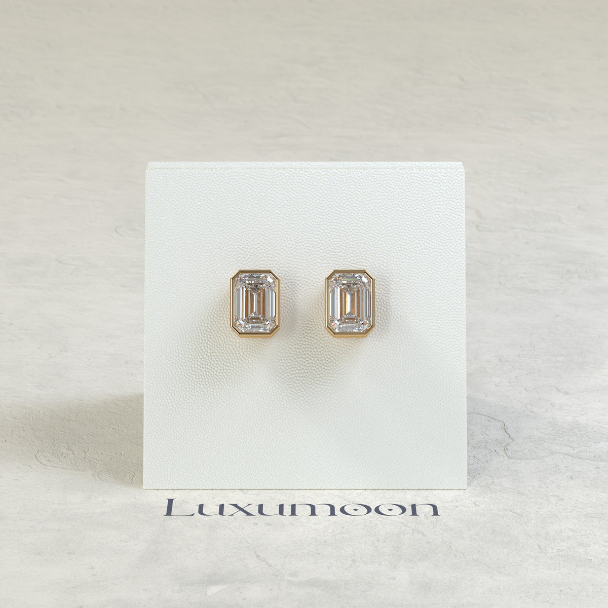 The Rynel – 3 Ct Emerald Cut Diamond Stud Earrings in Full Bezel Setting