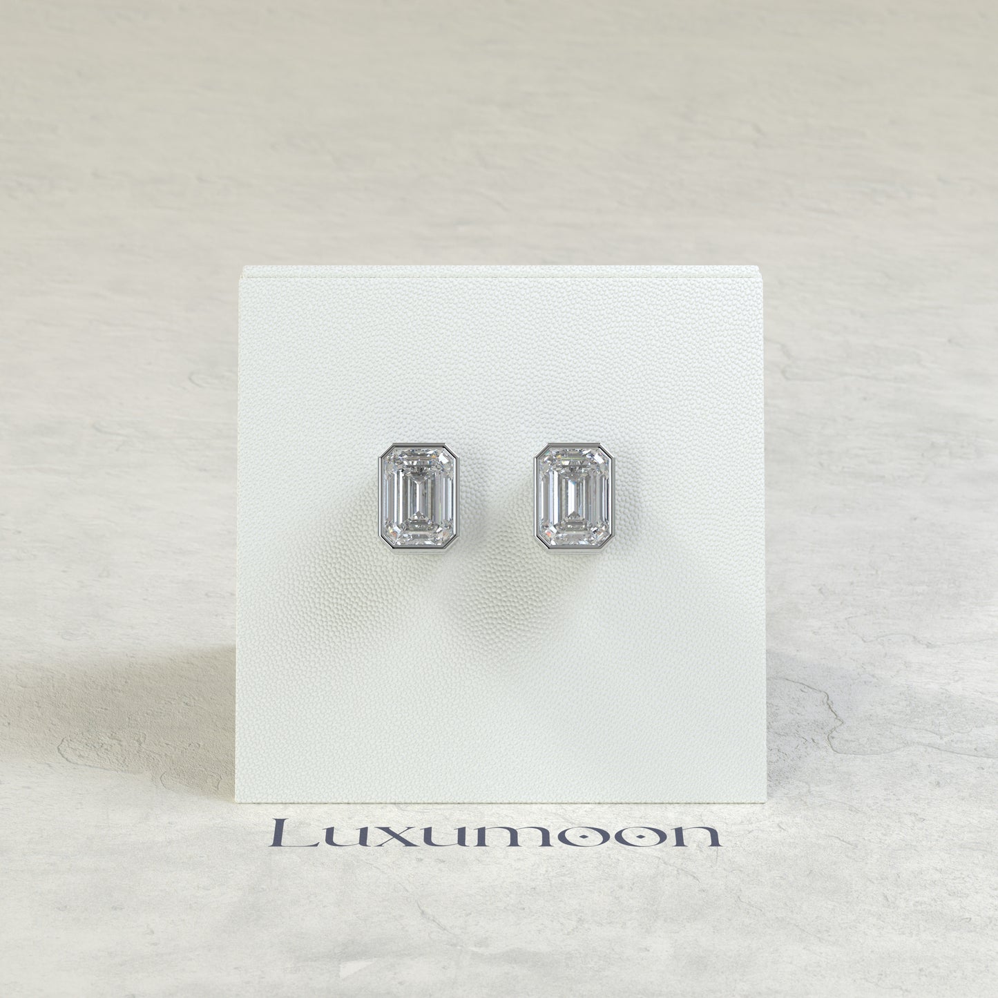 The Rynel – 3 Ct Emerald Cut Diamond Stud Earrings in Full Bezel Setting