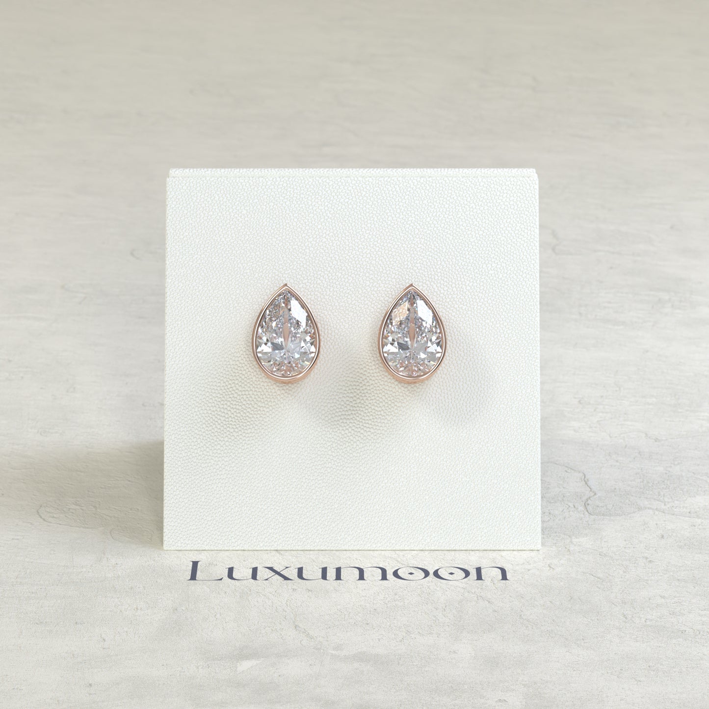 The Toria – 2 Ct Pear Diamond Solitaire Studs in Sleek Full Bezel Setting