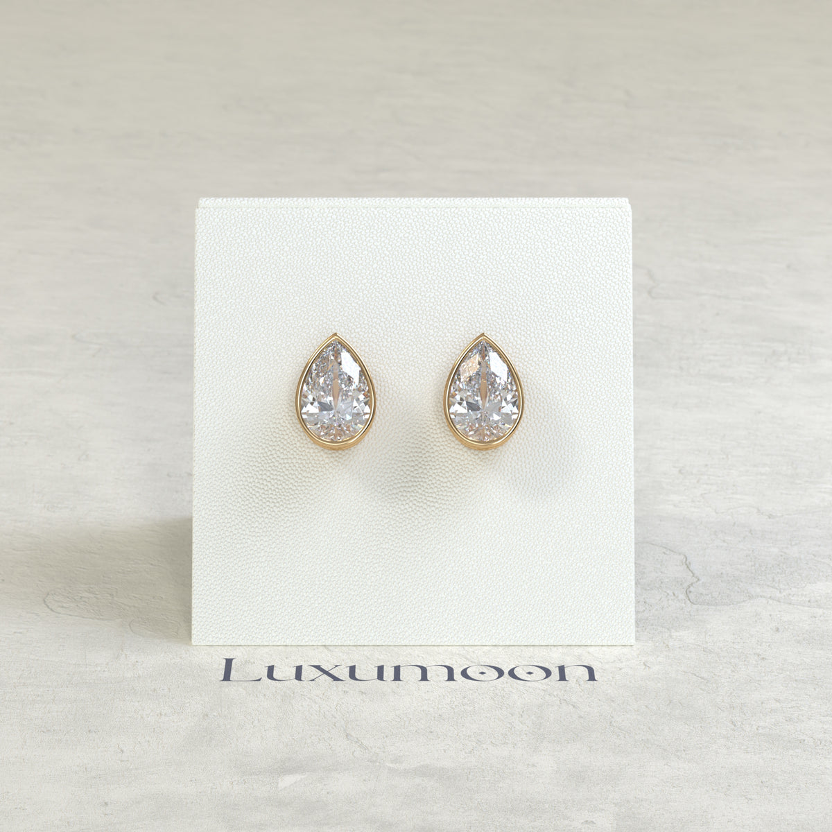 The Toria – 2 Ct Pear Diamond Solitaire Studs in Sleek Full Bezel Setting