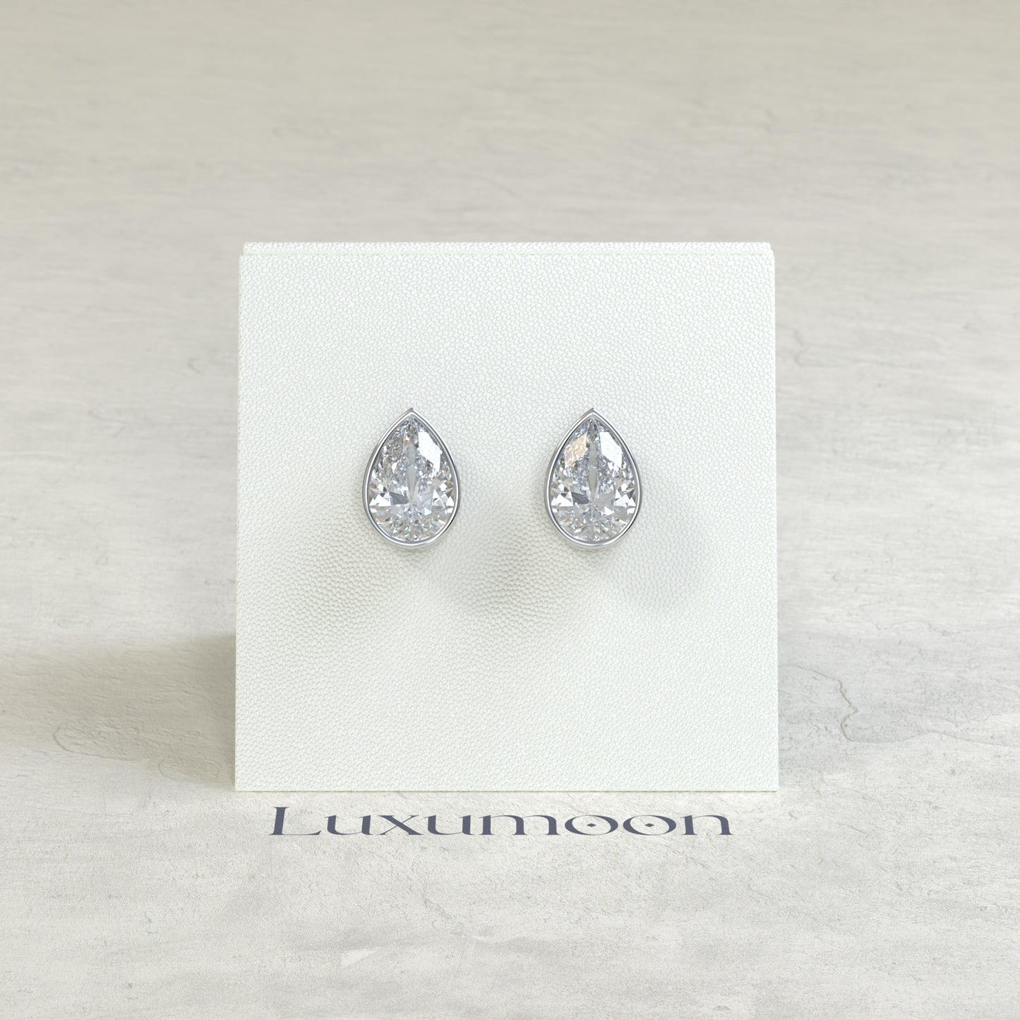 The Toria – 2 Ct Pear Diamond Solitaire Studs in Sleek Full Bezel Setting
