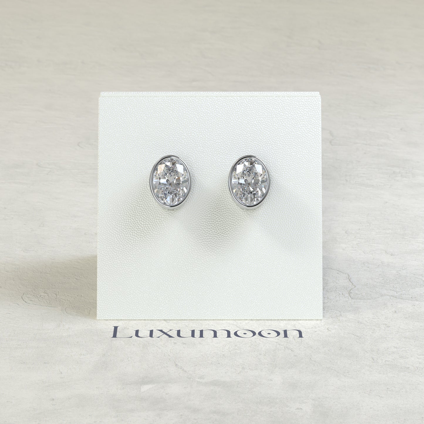 The Orel – 2 Ct Oval Diamond Solitaire Studs in Sleek Full Bezel Setting