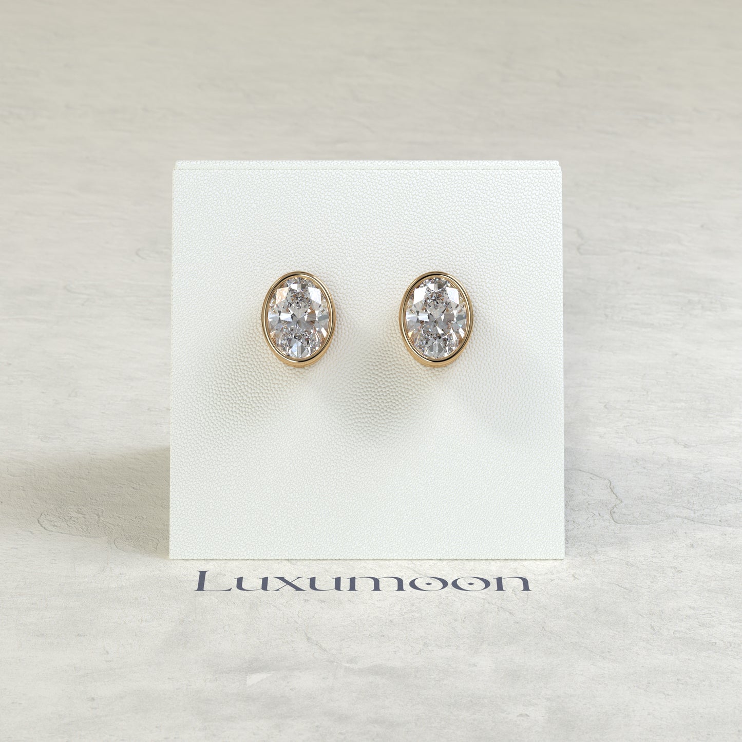 The Orel – 2 Ct Oval Diamond Solitaire Studs in Sleek Full Bezel Setting