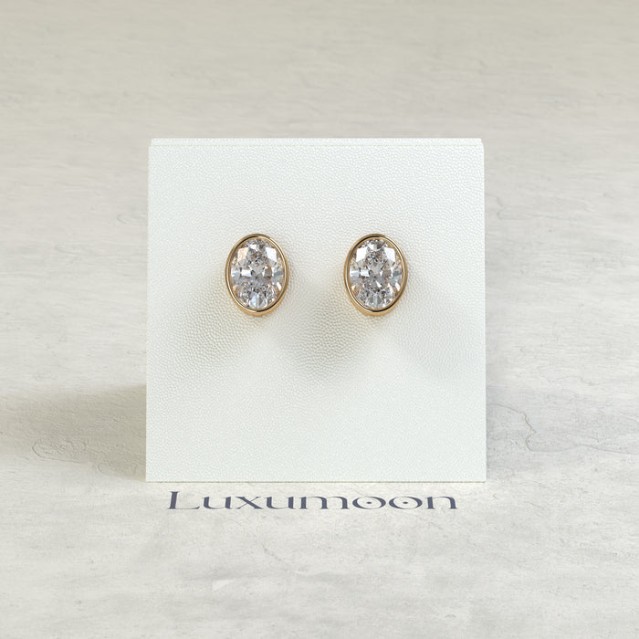 The Orel – 2 Ct Oval Diamond Solitaire Studs in Sleek Full Bezel Setting