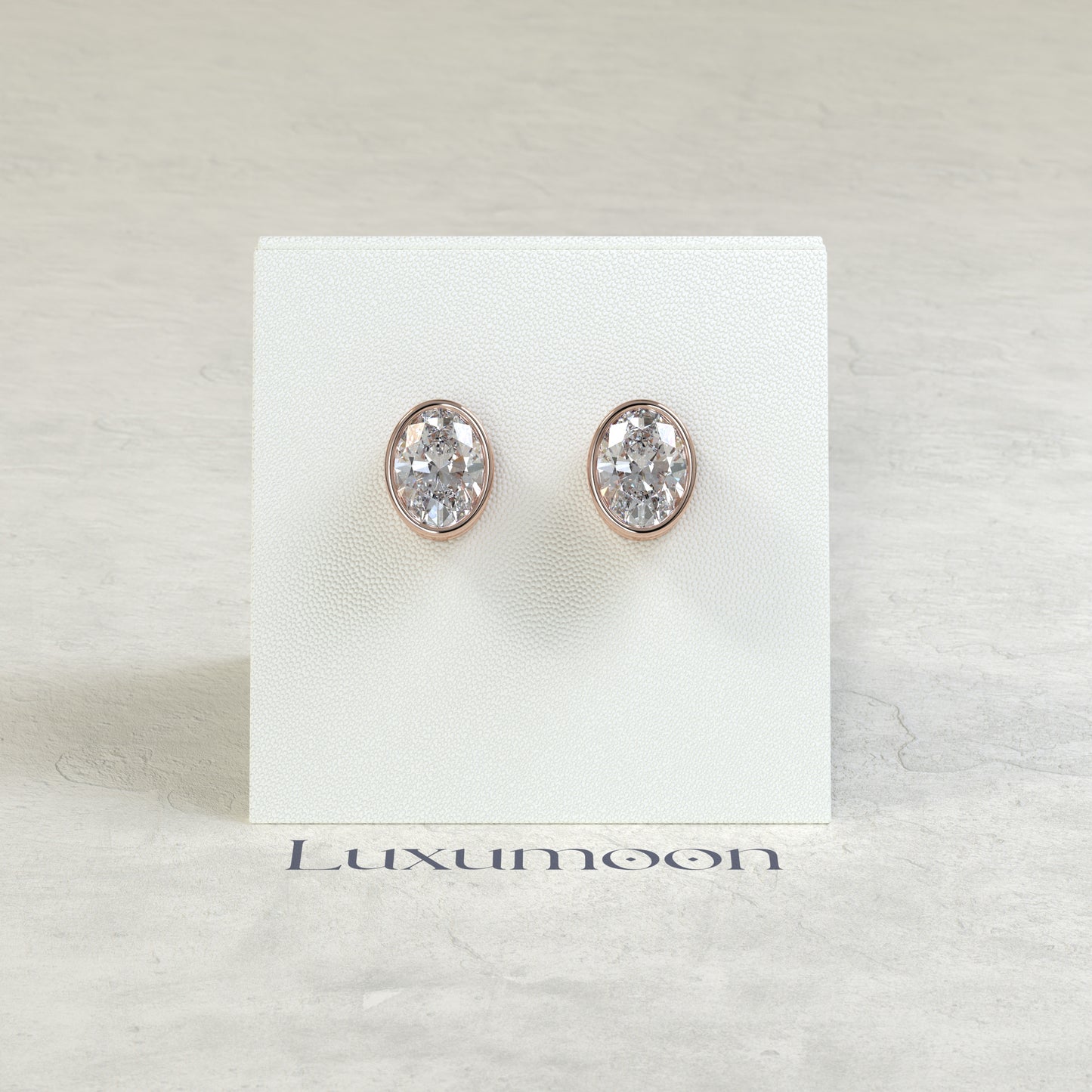 The Orel – 2 Ct Oval Diamond Solitaire Studs in Sleek Full Bezel Setting