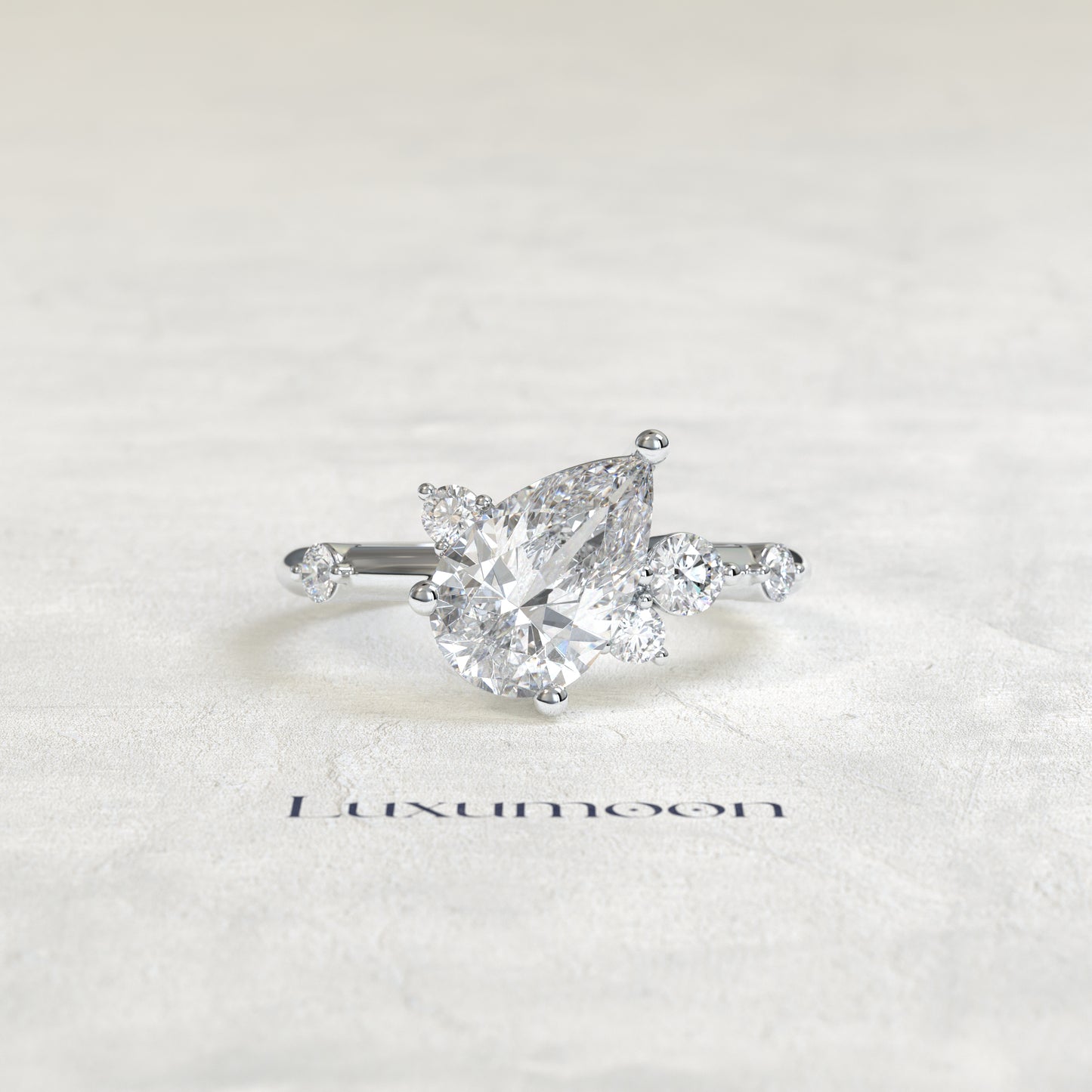 The Aure – Pear Cut Lab Grown Diamond Scattered Accent Engagement Ring