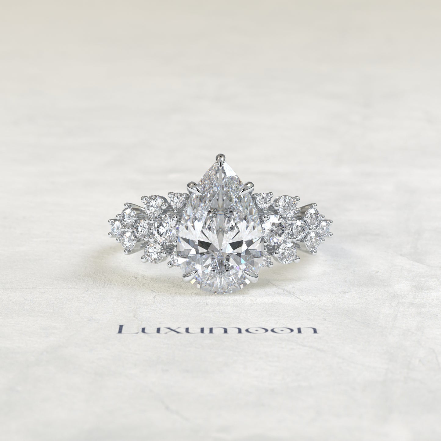 The Cora – Pear Cut Lab Grown Diamond Scattered Round Cluster Shoulder Engagement Ring