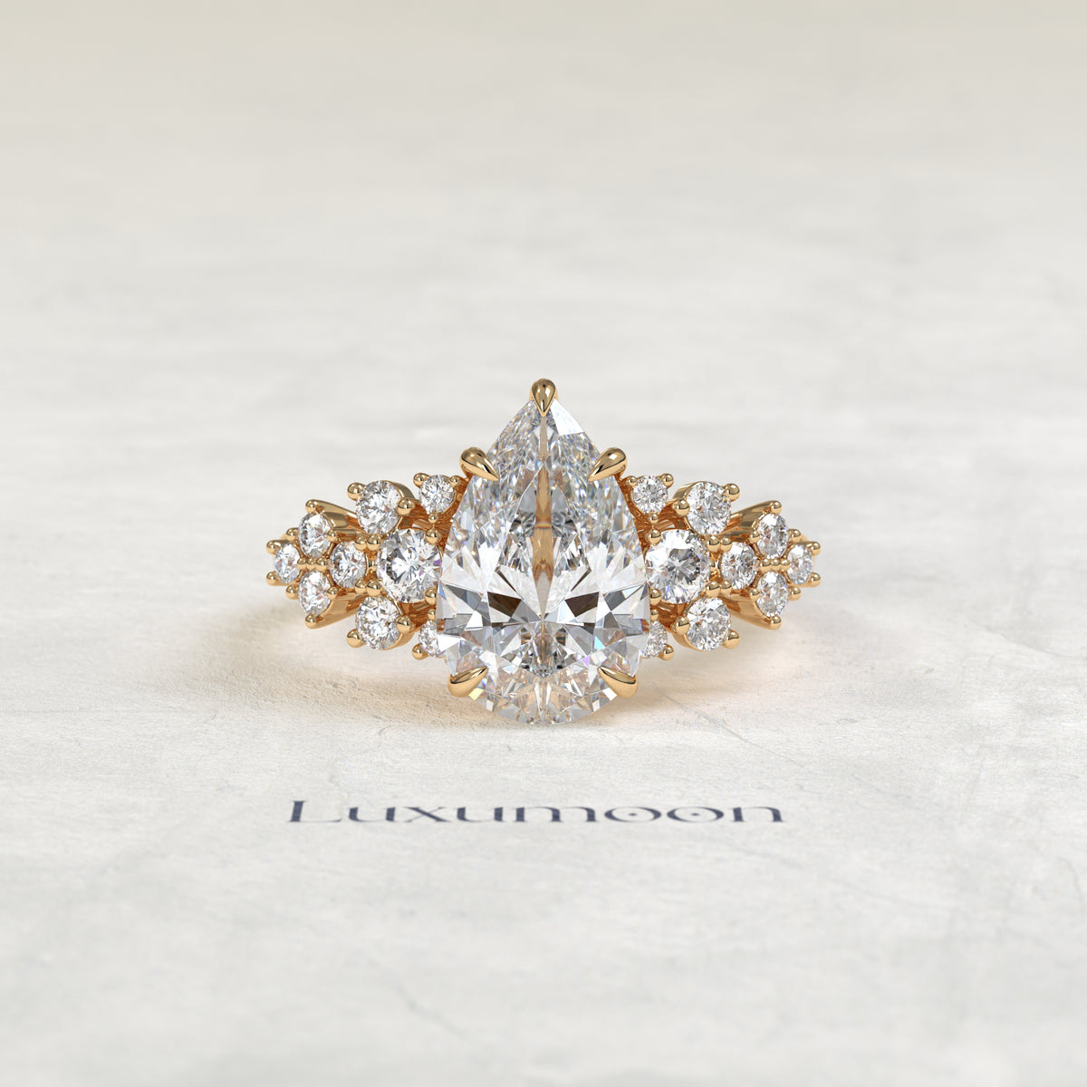 The Cora – Pear Cut Lab Grown Diamond Scattered Round Cluster Shoulder Engagement Ring