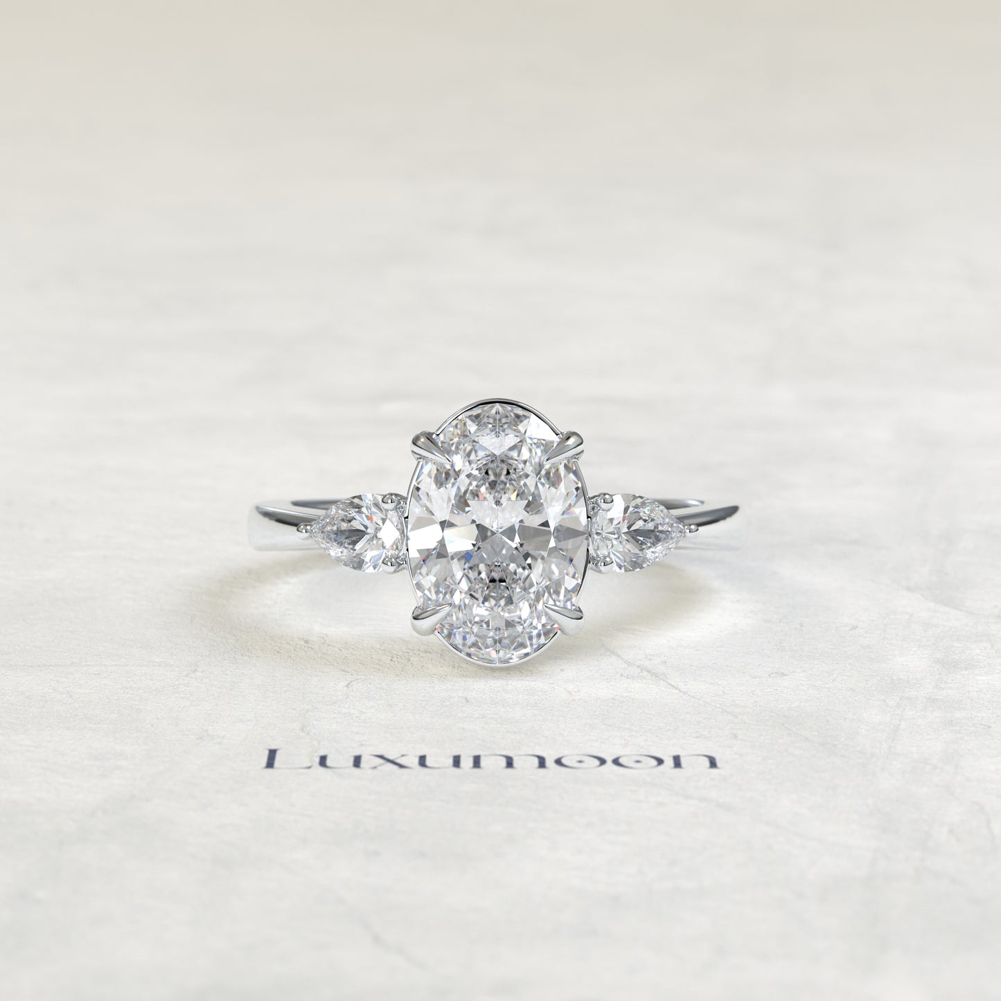 The Lyna – Oval & Pear Lab Grown Diamond Classic Three Stone Engagement Ring