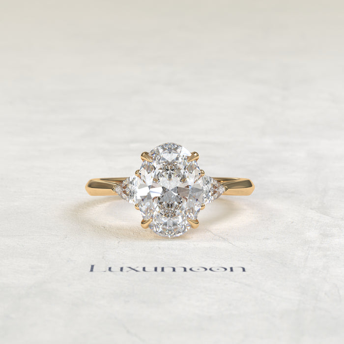 The Evara – Oval & Trillion Cut Lab Grown Diamond Three Stone Cathedral Engagement Ring