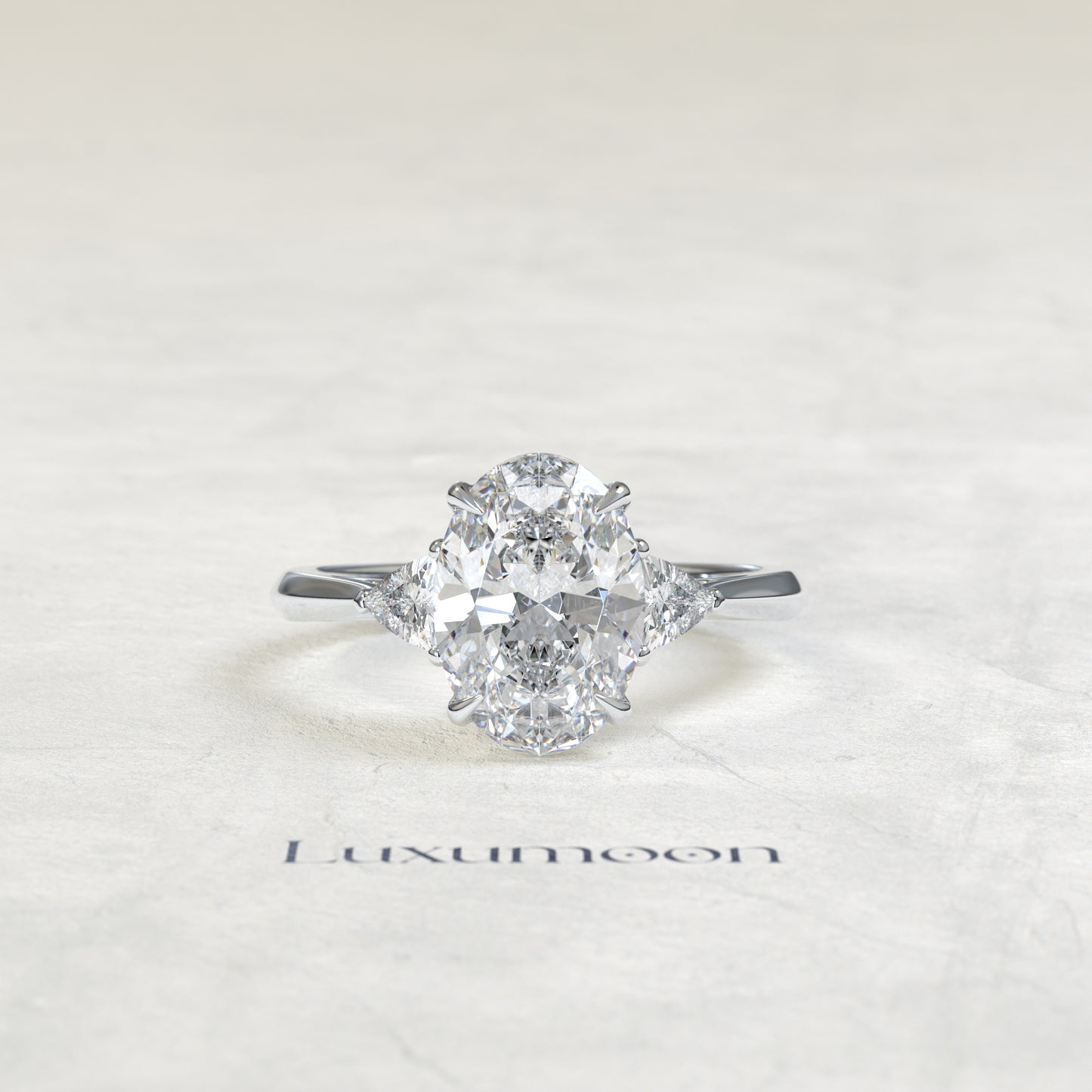 The Evara – Oval & Trillion Cut Lab Grown Diamond Three Stone Cathedral Engagement Ring