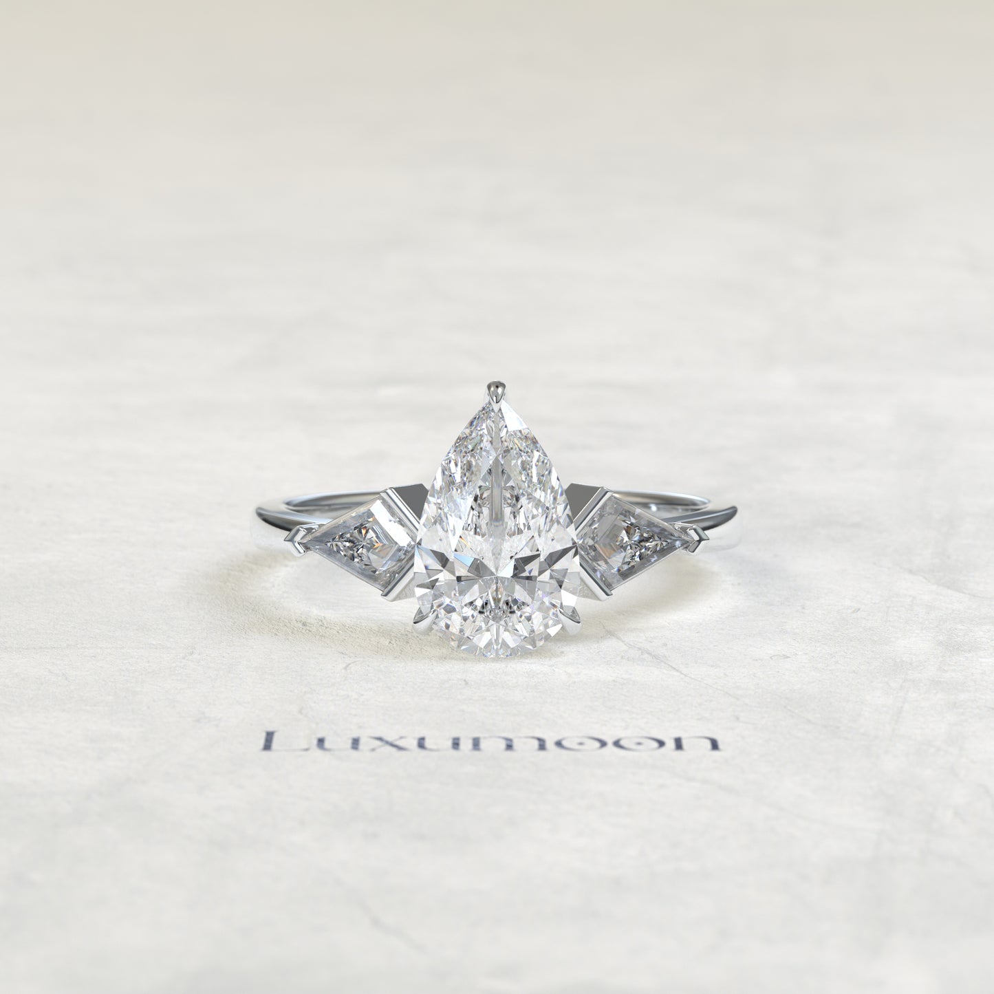 The Loela – Pear Cut Lab Grown Diamond Kite Side Stone Three Stone Engagement Ring