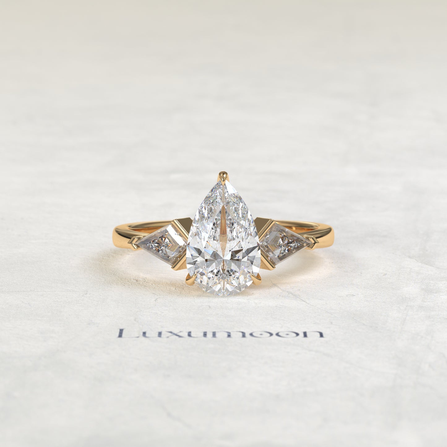 The Loela – Pear Cut Lab Grown Diamond Kite Side Stone Three Stone Engagement Ring