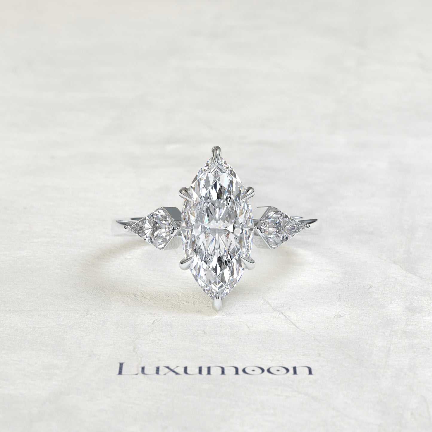 The Qela – Marquise Cut Lab Grown Diamond Kite Side Stone Three Stone Engagement Ring