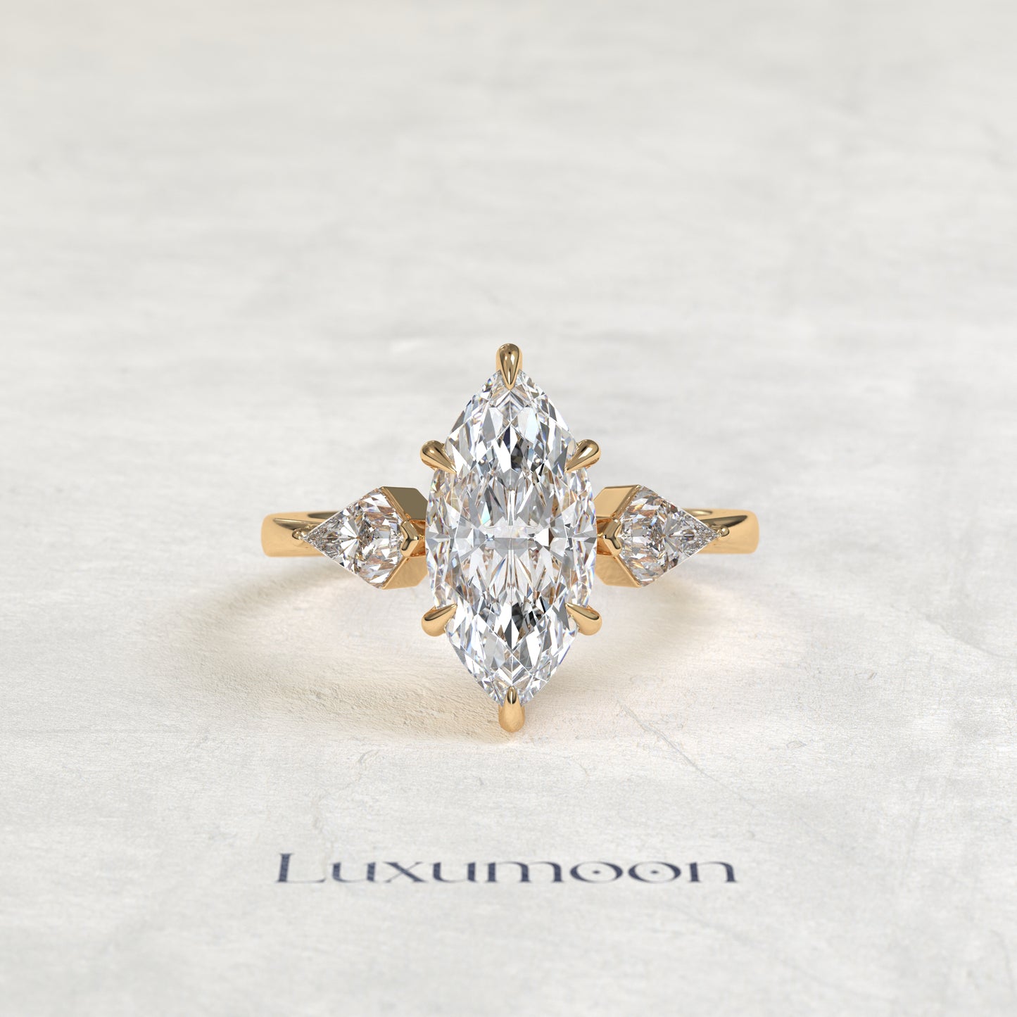 The Qela – Marquise Cut Lab Grown Diamond Kite Side Stone Three Stone Engagement Ring