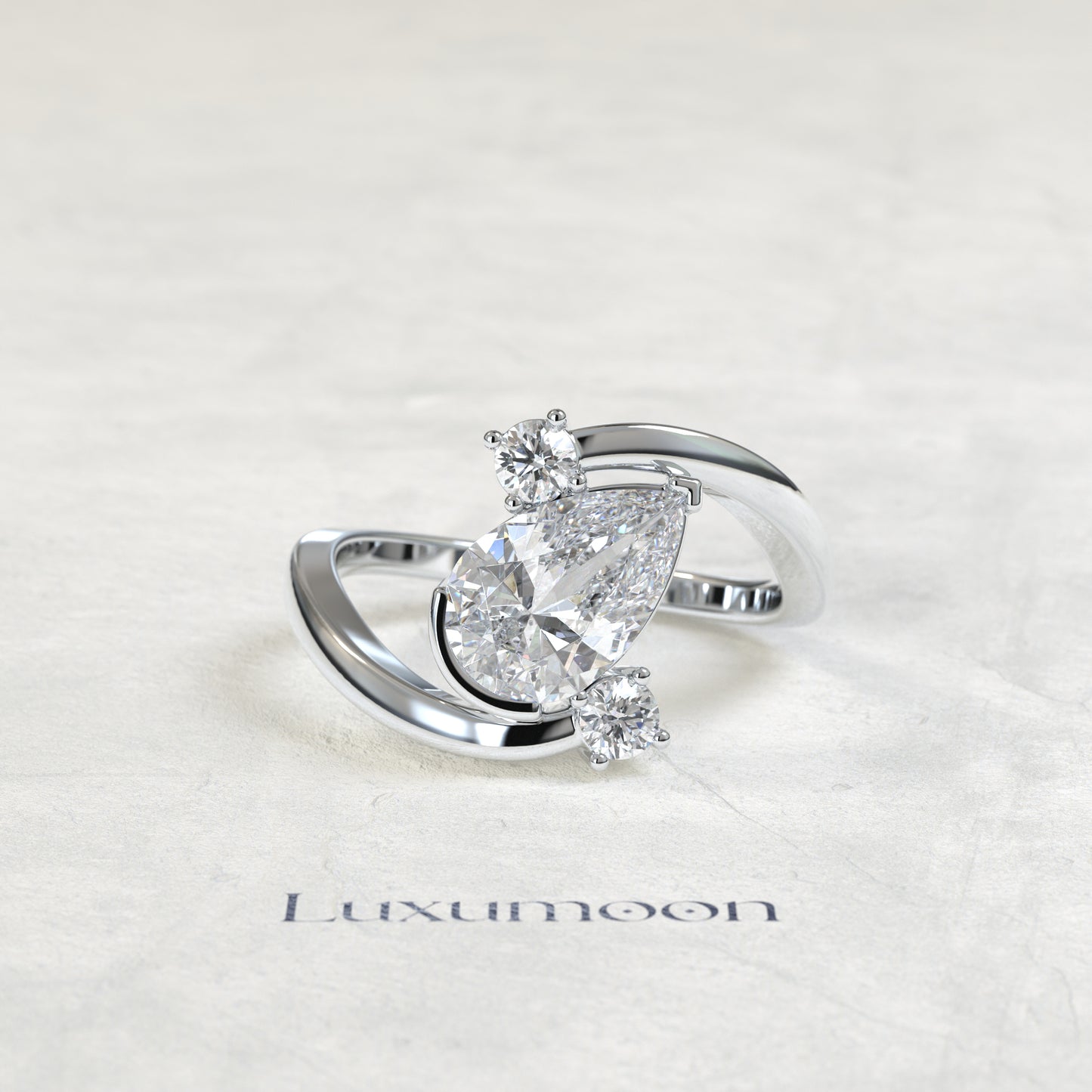 The Geova – Pear Lab Grown Diamond Open Bypass Tilted Setting Round Diamond Engagement Ring