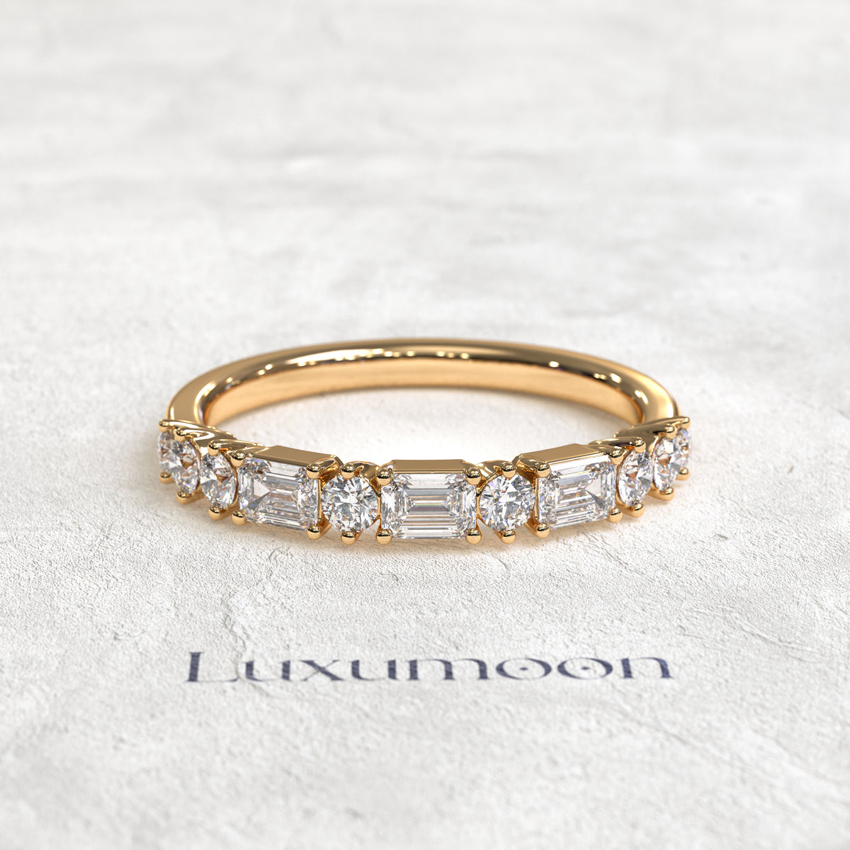 The Solenthia – East-West Emerald & Round Diamond Band